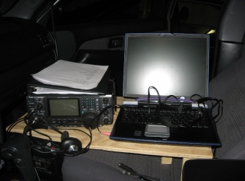 Operating Position close up.  Icom IC-756PRO secured to table.  Laptop quick-disconnect bungie so I can use it on my lap when operating stationary.  Laptop power supply rated at 15V/4A at DC - very efficient, albeit a Toshiba. :-)